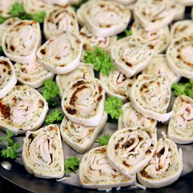 Turkey pinwheel appetizers on a platter.
