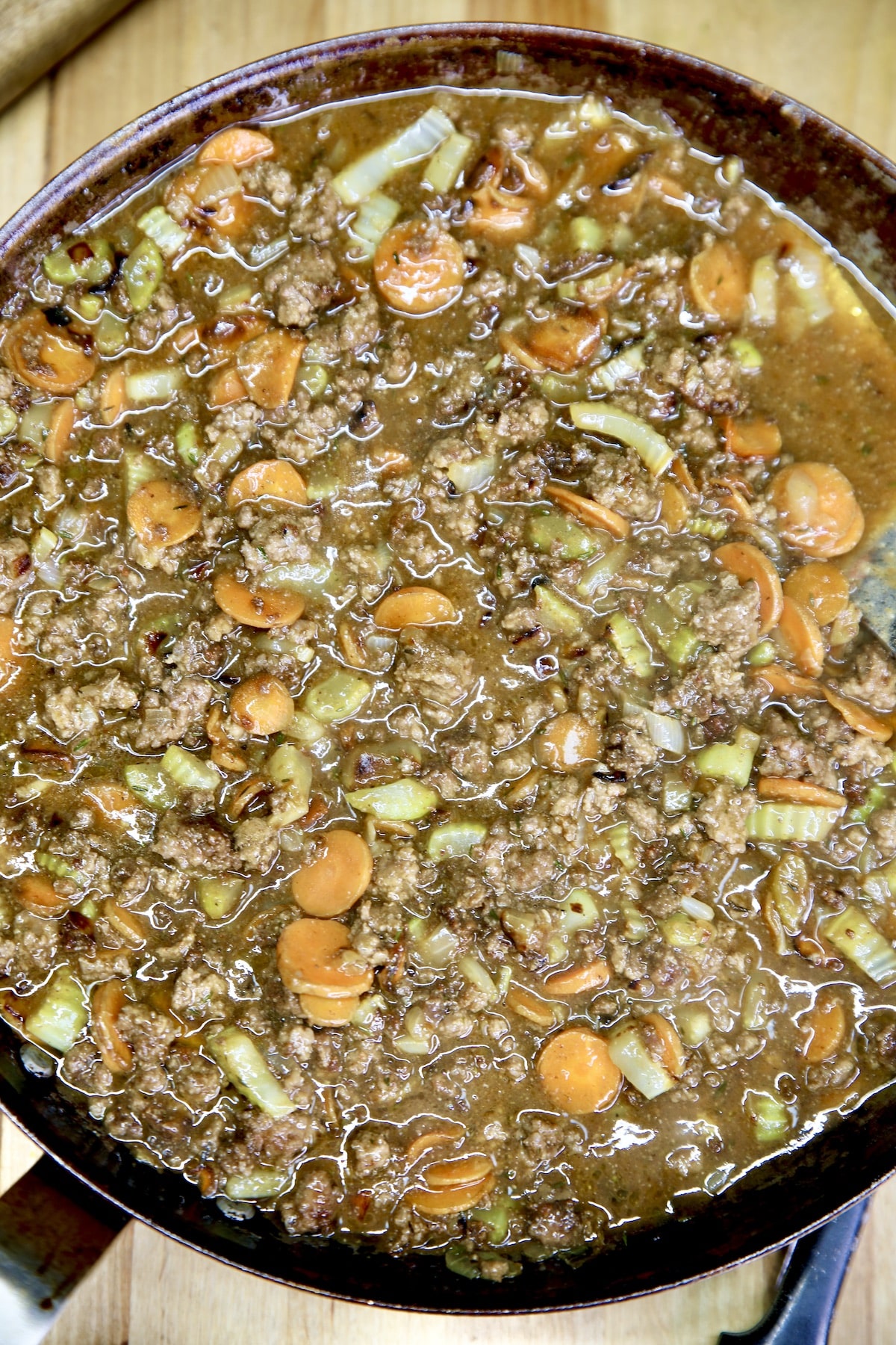 Ground beef, vegetable and gravy filling for cottage pie.