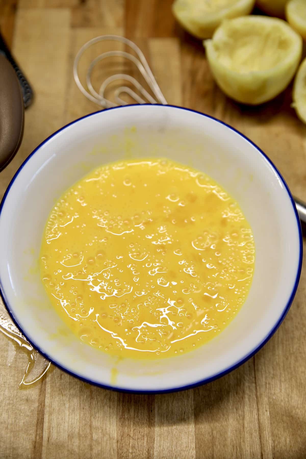 Beaten eggs in a bowl.