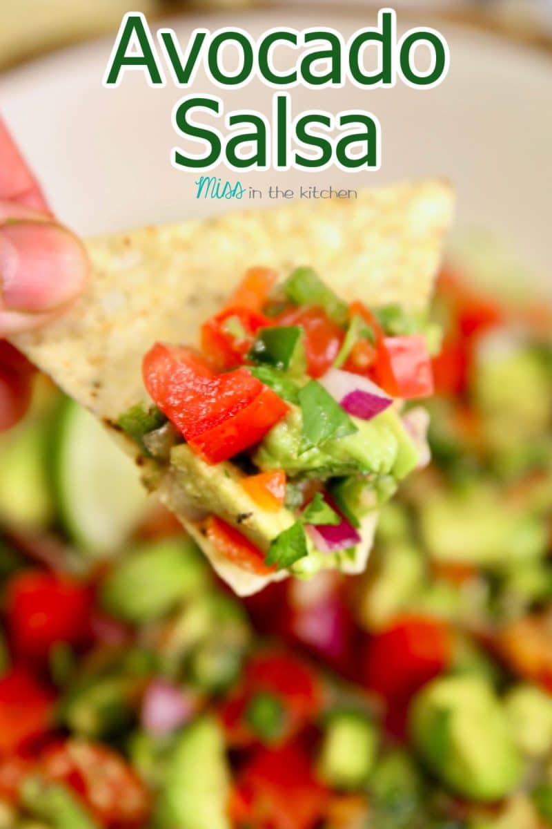 Chip dipping into avocado salsa - text overlay.