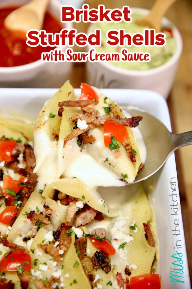 Shells stuffed with brisket with sour cream sauce. Text overlay.