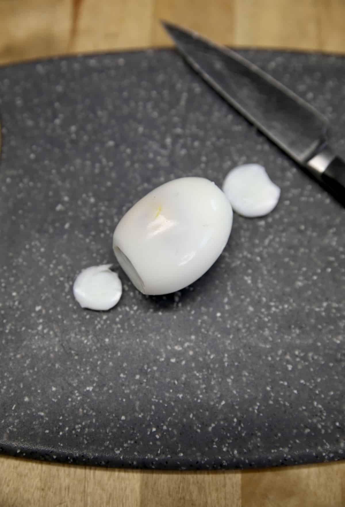 Hard boiled egg with ends sliced. 