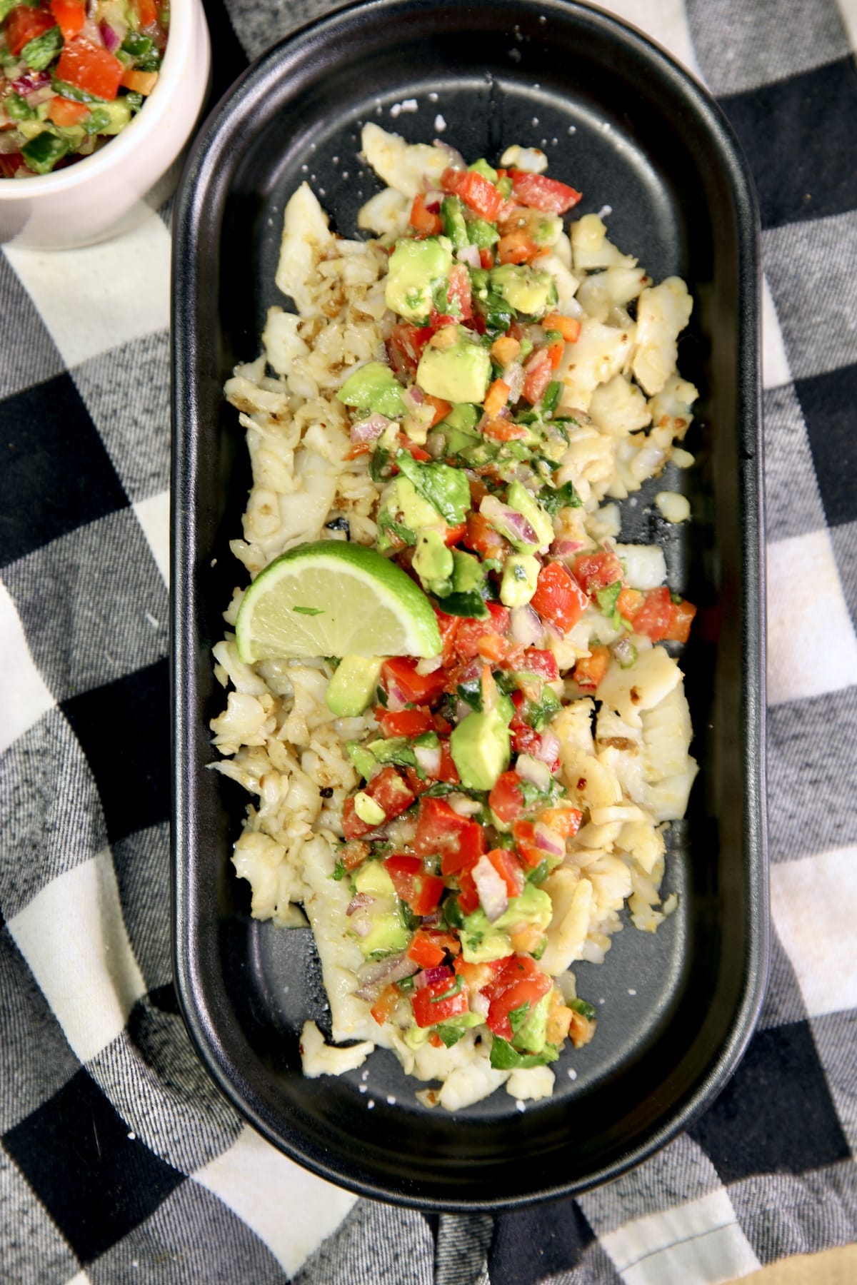 Platter of fish with avocado salsa.