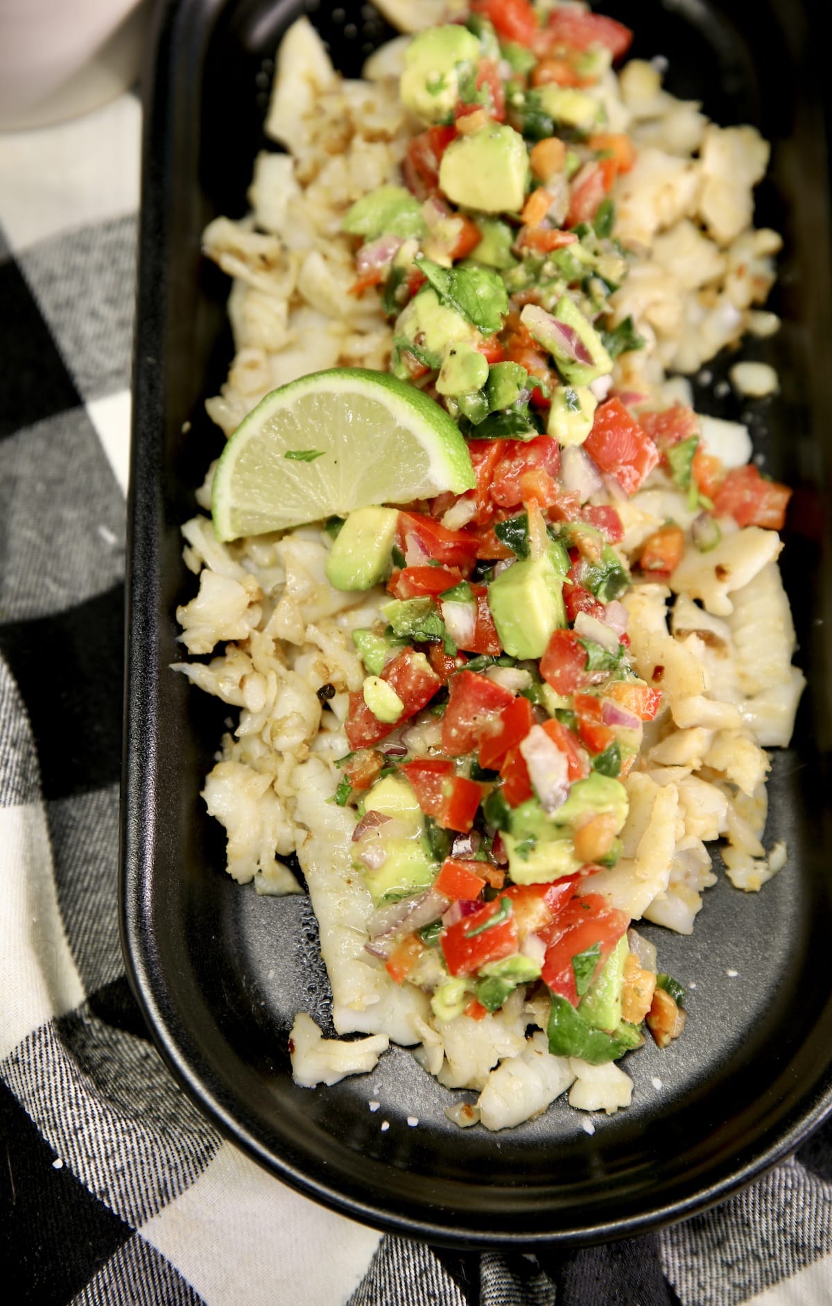 Closeup of fish with avocado salsa.