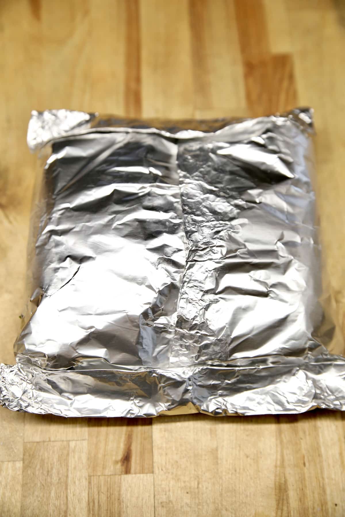 Foil packet with corn on the cob.