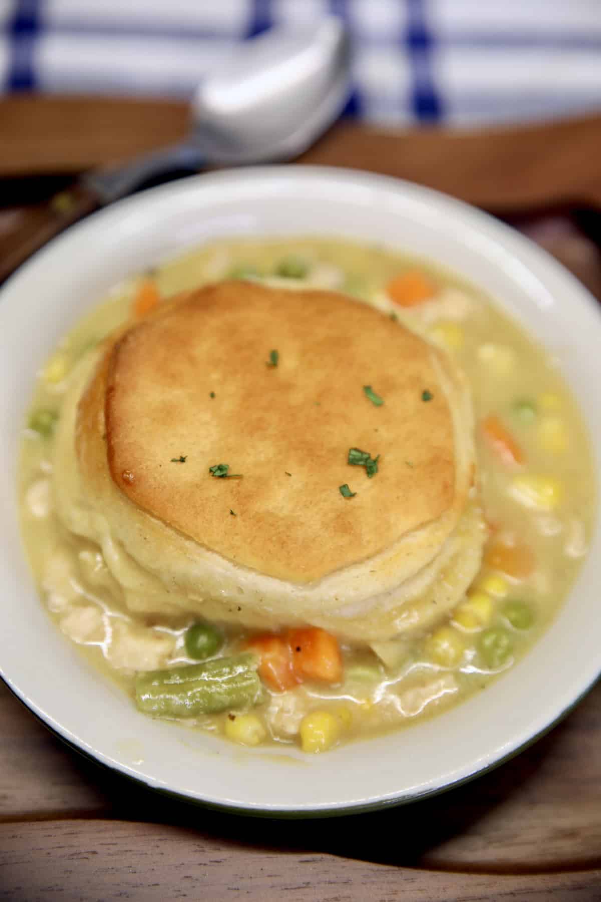 Chicken pot pie casserole ready in 30 minutes. Chicken Pot Pie with biscuit topping in a bowl.