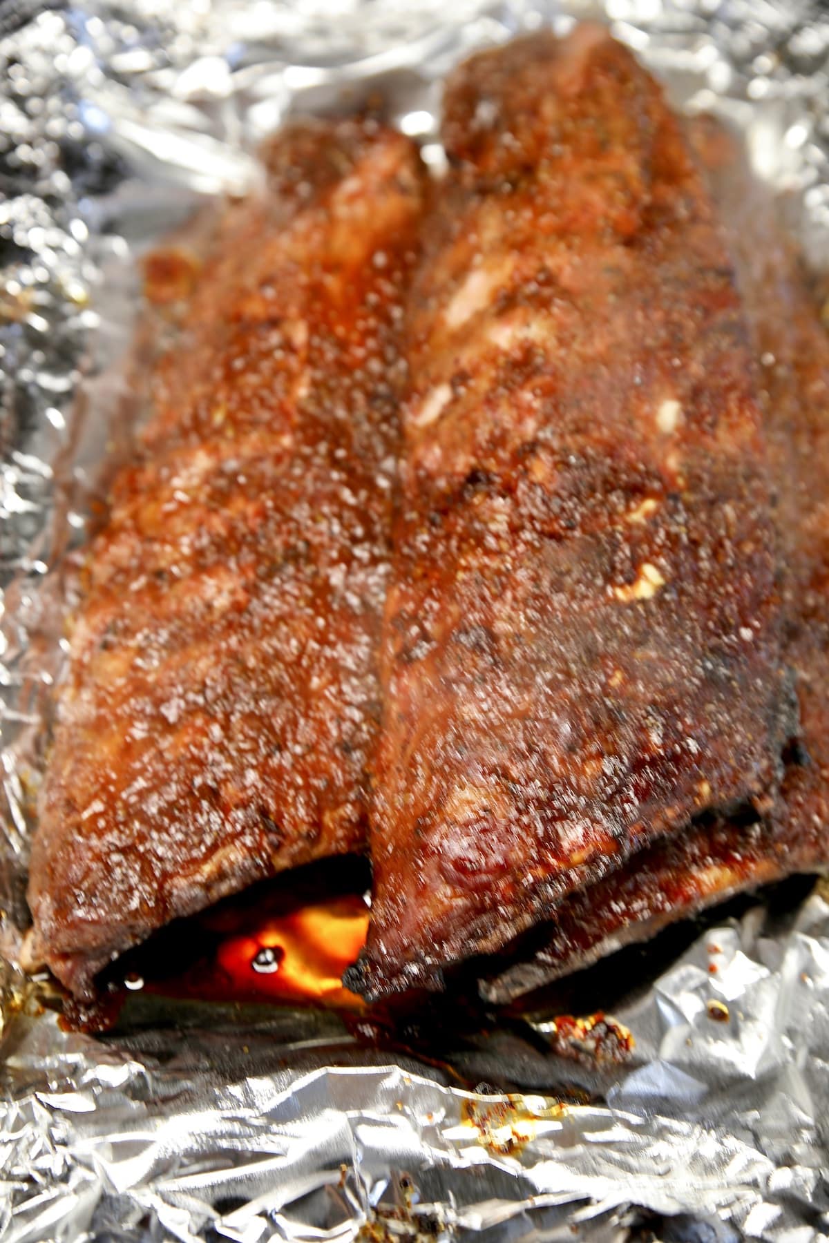 3 racks smoked ribs on foil.