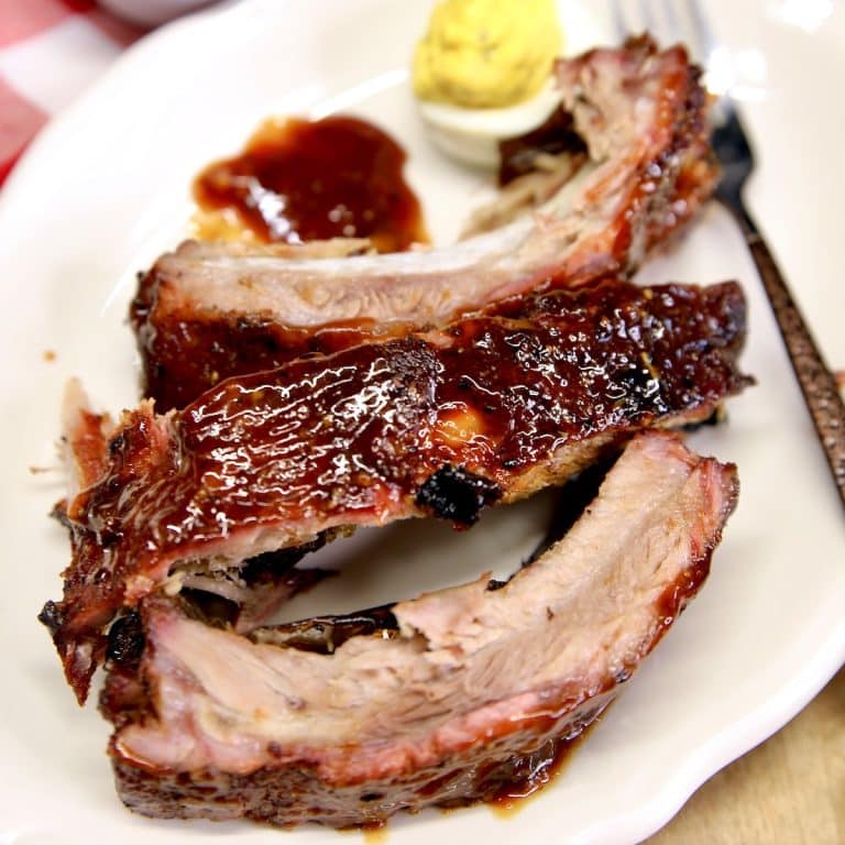 Baby back ribs on a plate.