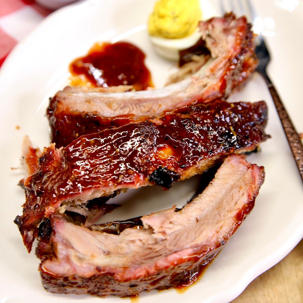 Baby back ribs on a plate.
