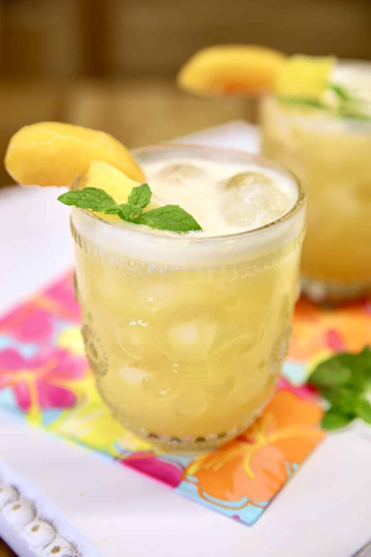 2 glasses of pineapple peach wine punch.
