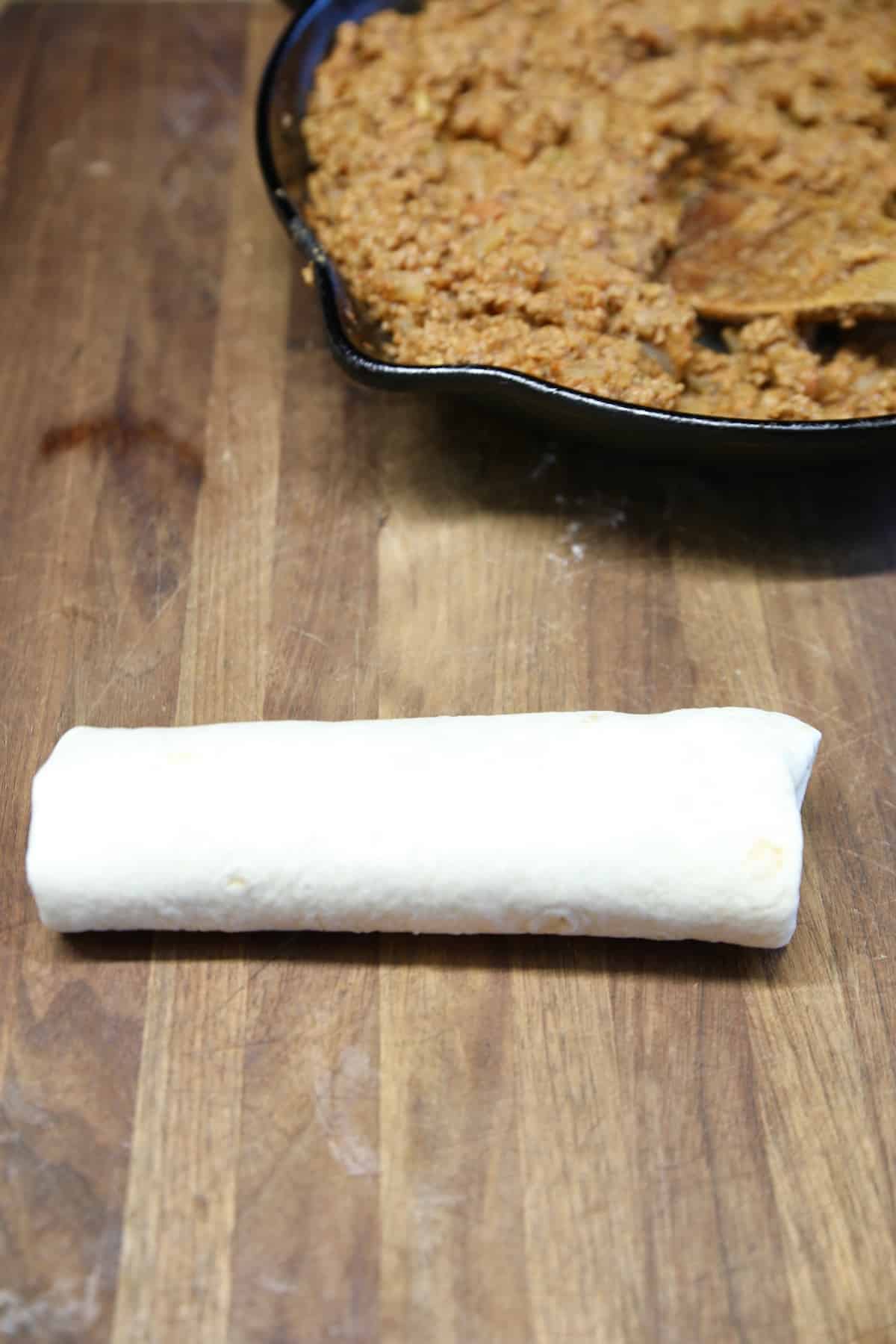 Rolled up beef and bean burrito. 