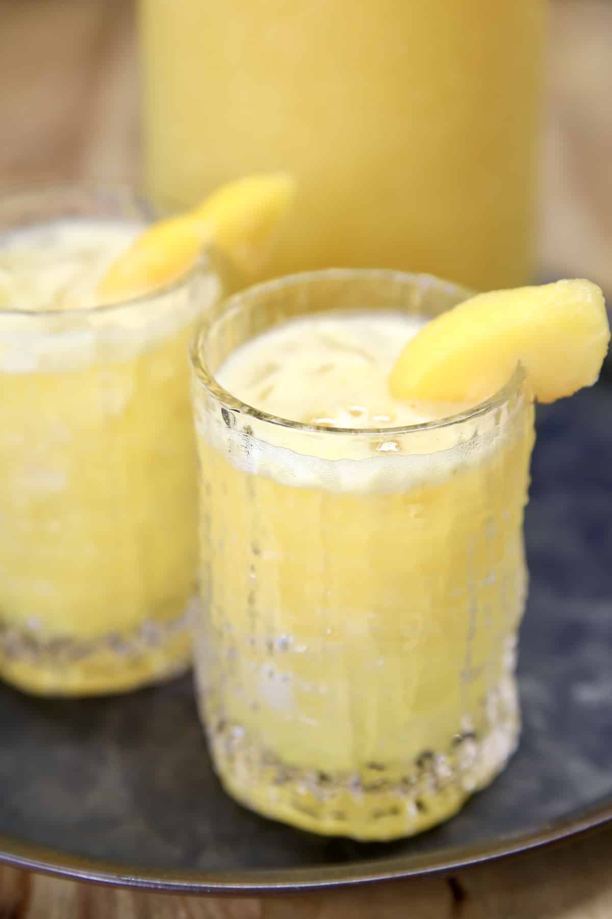 Peach Mango Moscato punch in 2 glasses.