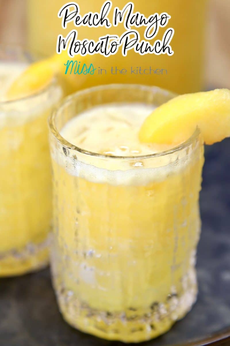 Peach Mango Moscato Punch in a glass - text overlay.