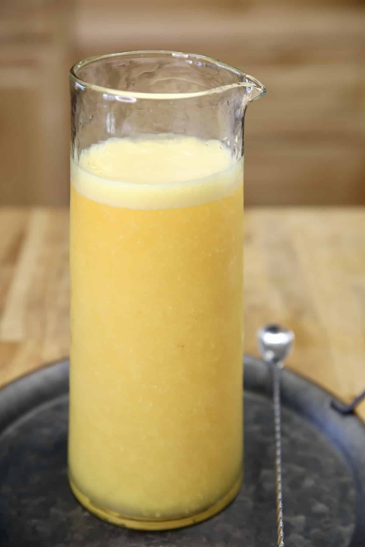 Peach Mango Moscato Punch in a pitcher.