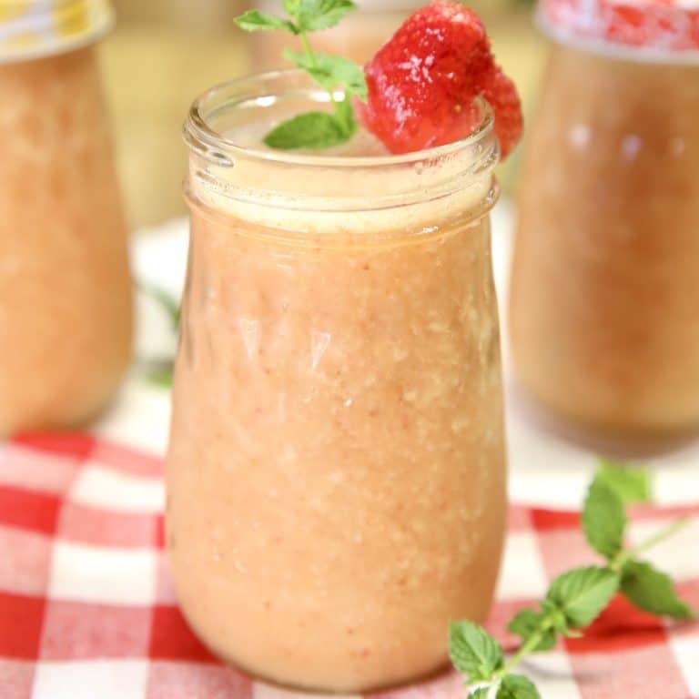 Strawberry mango wine coolers in mason jars.