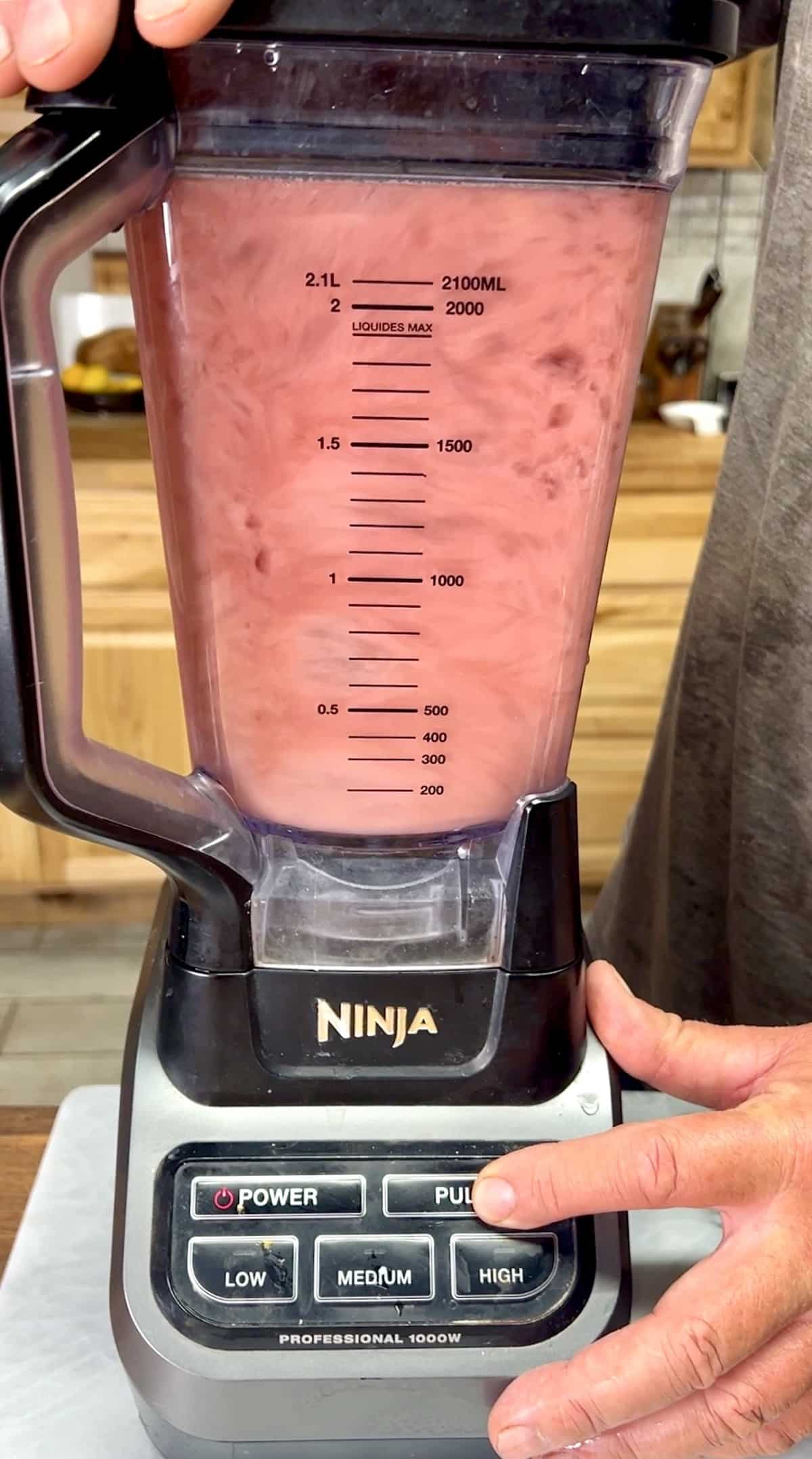 Blender with black cherry margaritas.