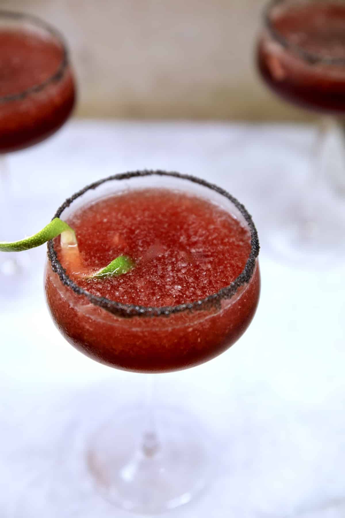 Overhead view of black cherry margaritas.