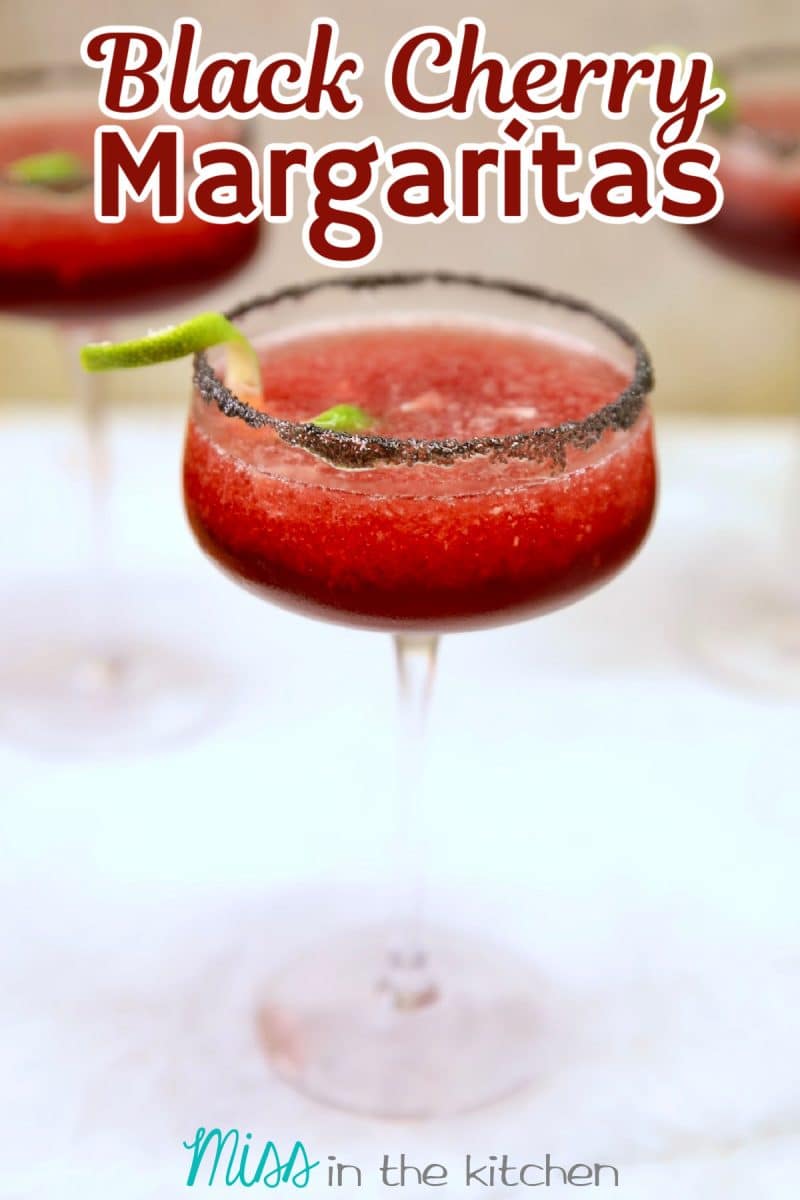 Black Cherry Margaritas with black salt rim. Text overlay.