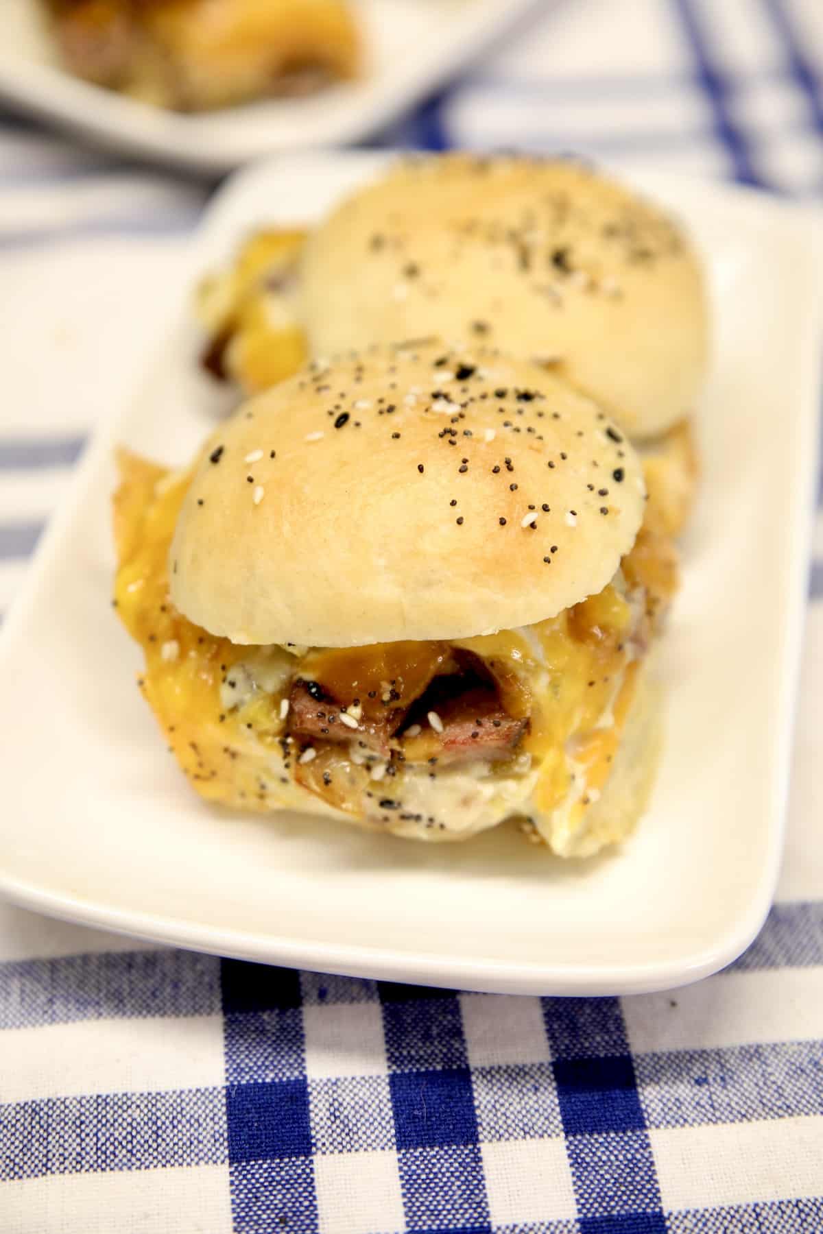 Steak sliders on a plate.