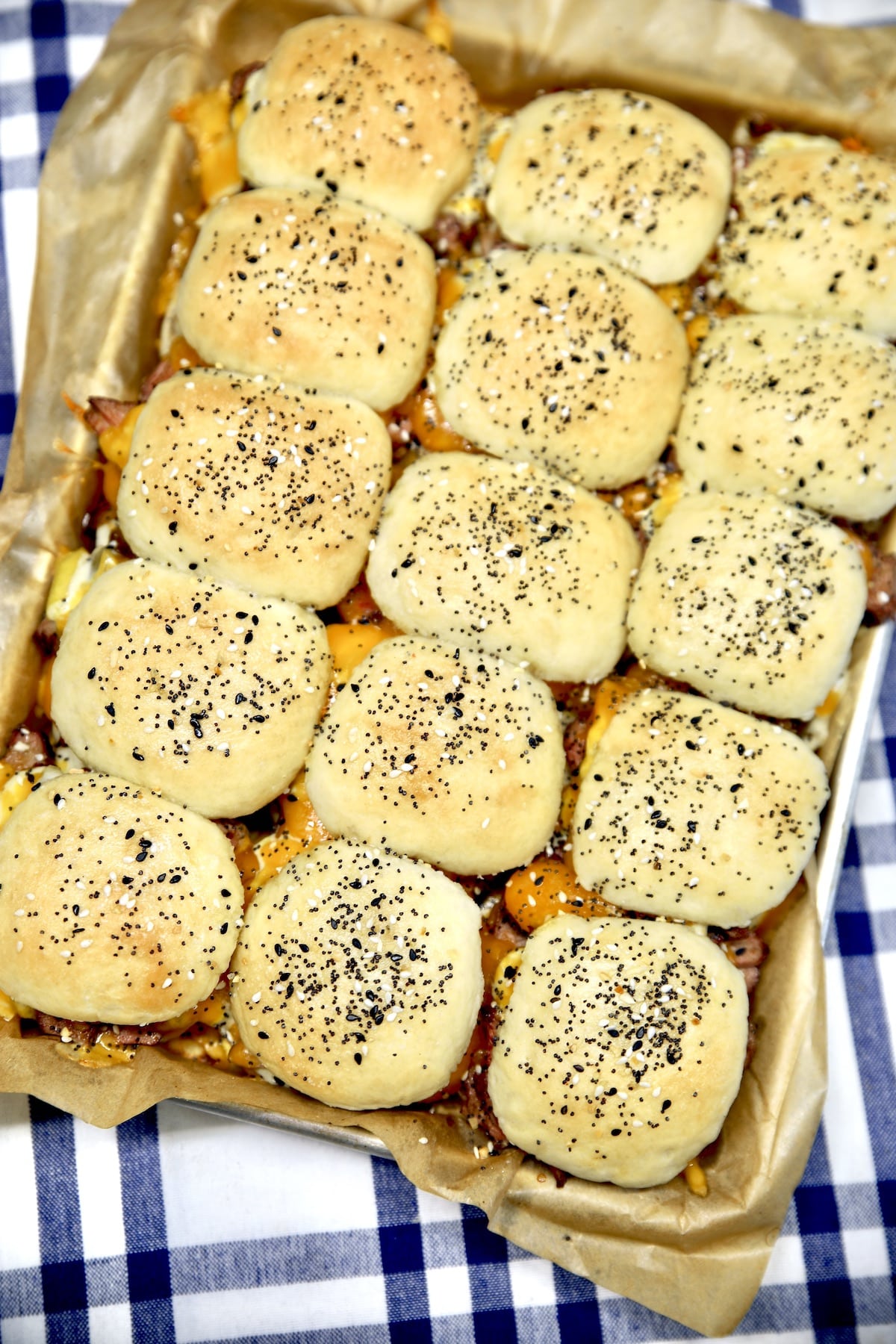 Pan of steak sliders on a baking sheet.