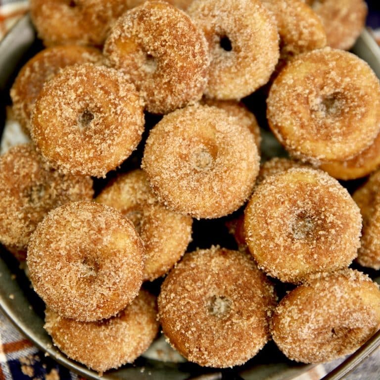 Mini apple cider donuts on a platter.