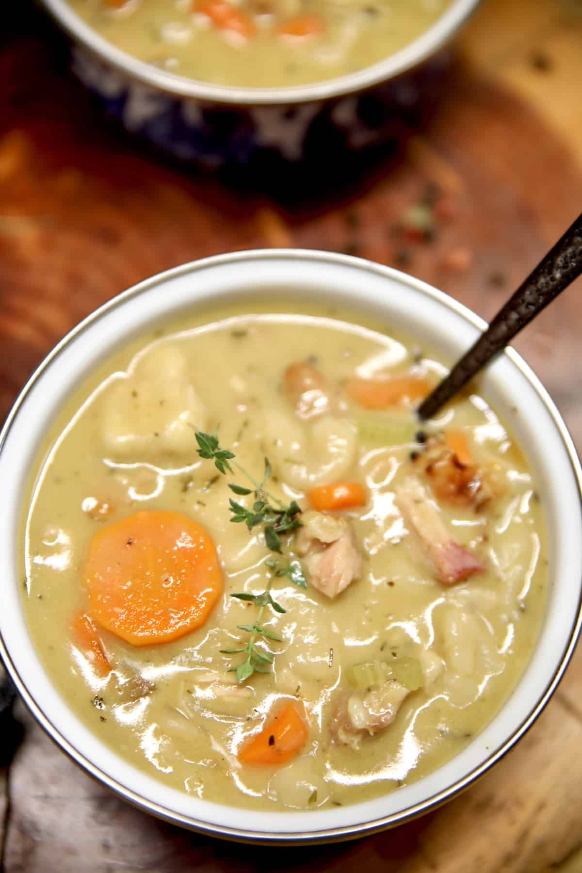 Quick and easy chicken and dumplings recipe. Chicken and dumplings in a bowl with a spoon.