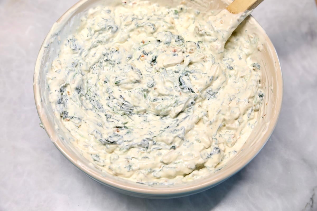 Creamy spinach dip in a bowl.