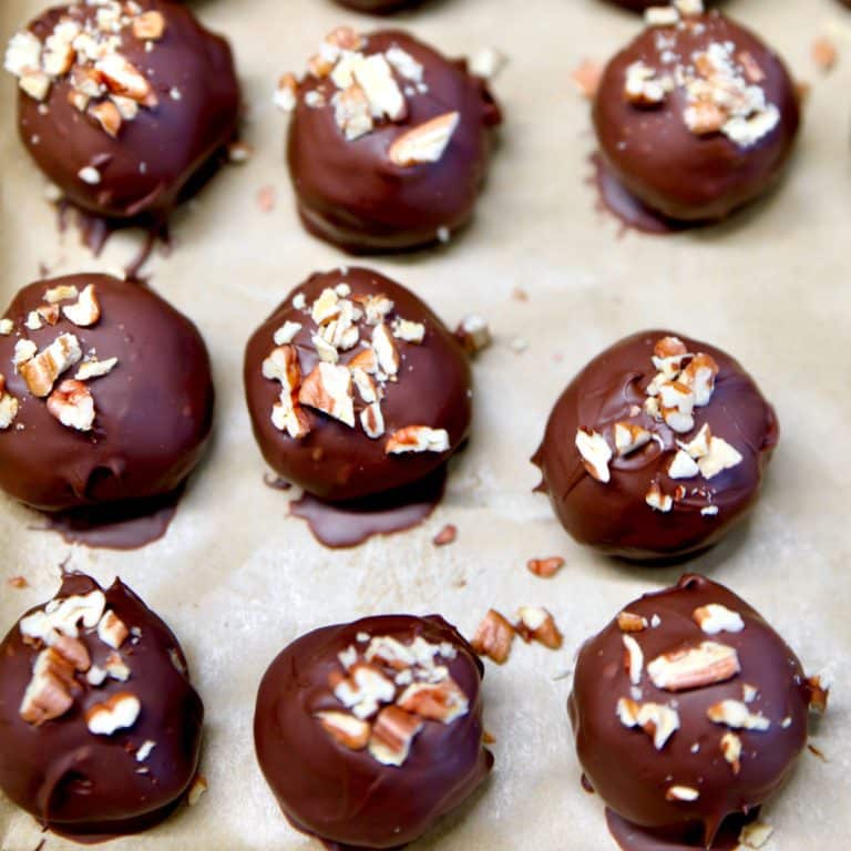 Bourbon pecan balls on a baking sheet.