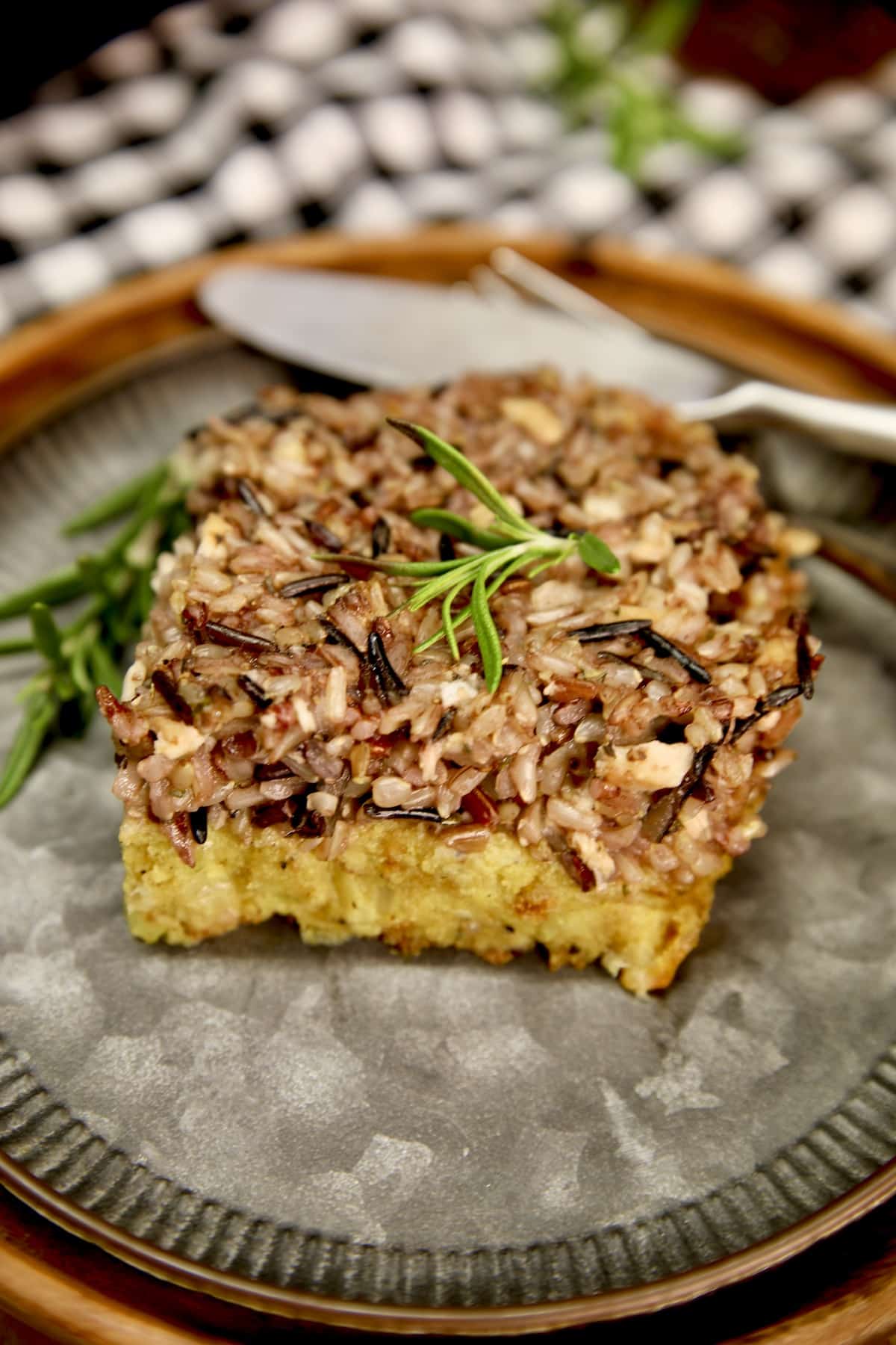 Cornbread and Wild Rice Dressing for Thanksgiving dinner. Cornbread and Wild Rice Dressing on a plate.
