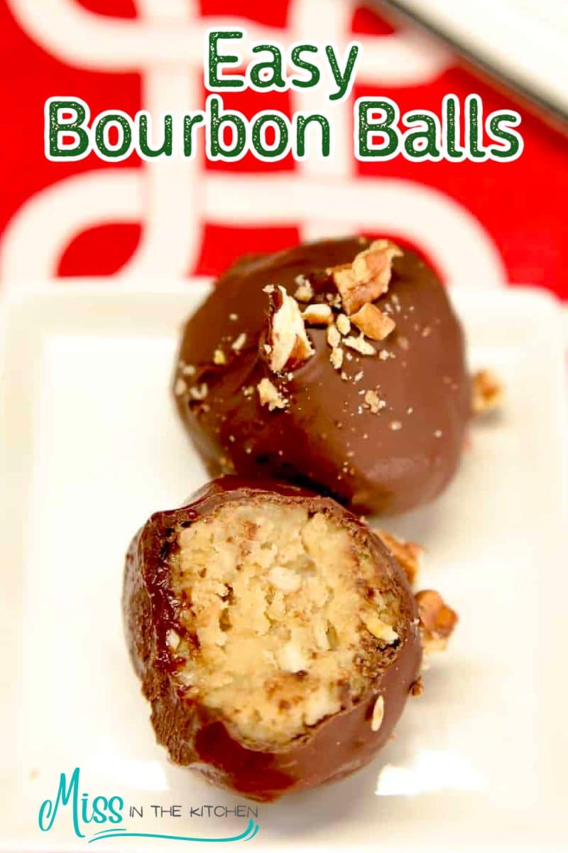 2 Bourbon balls on a plate, one showing filling.
