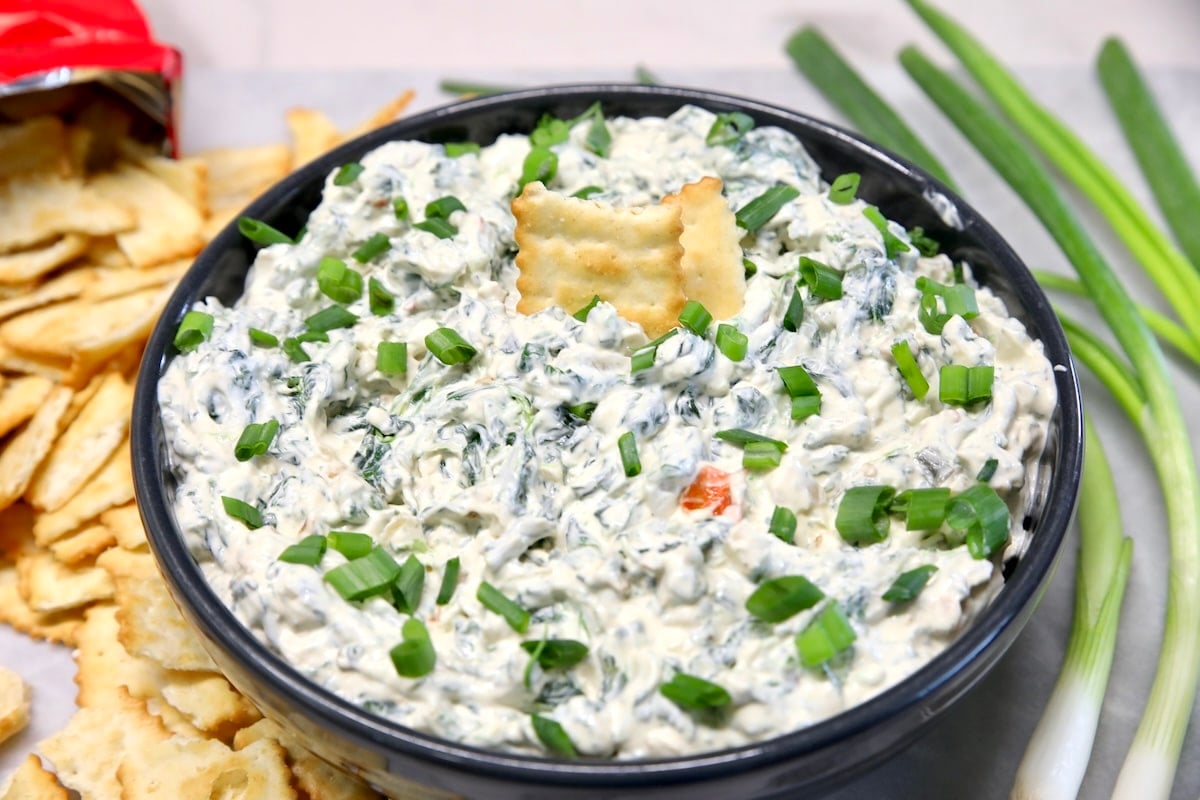 Creamy spinach dip made with Knorr vegetable mix. Bowl of knorr spinach dip.