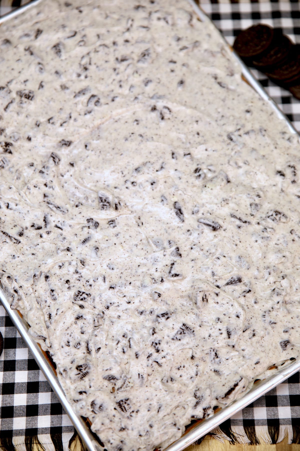 Chocolate sheet cake with cookies and cream icing.