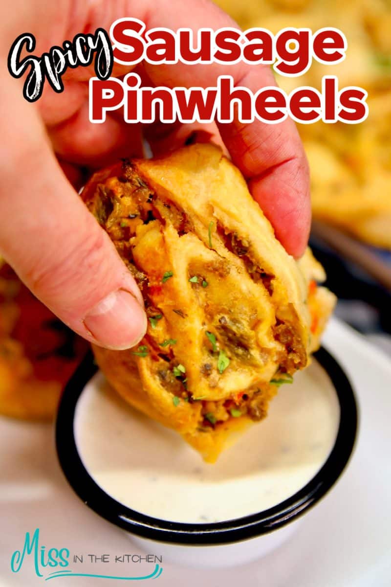 Sausage Pinwheel dipping into ranch. Text overlay.