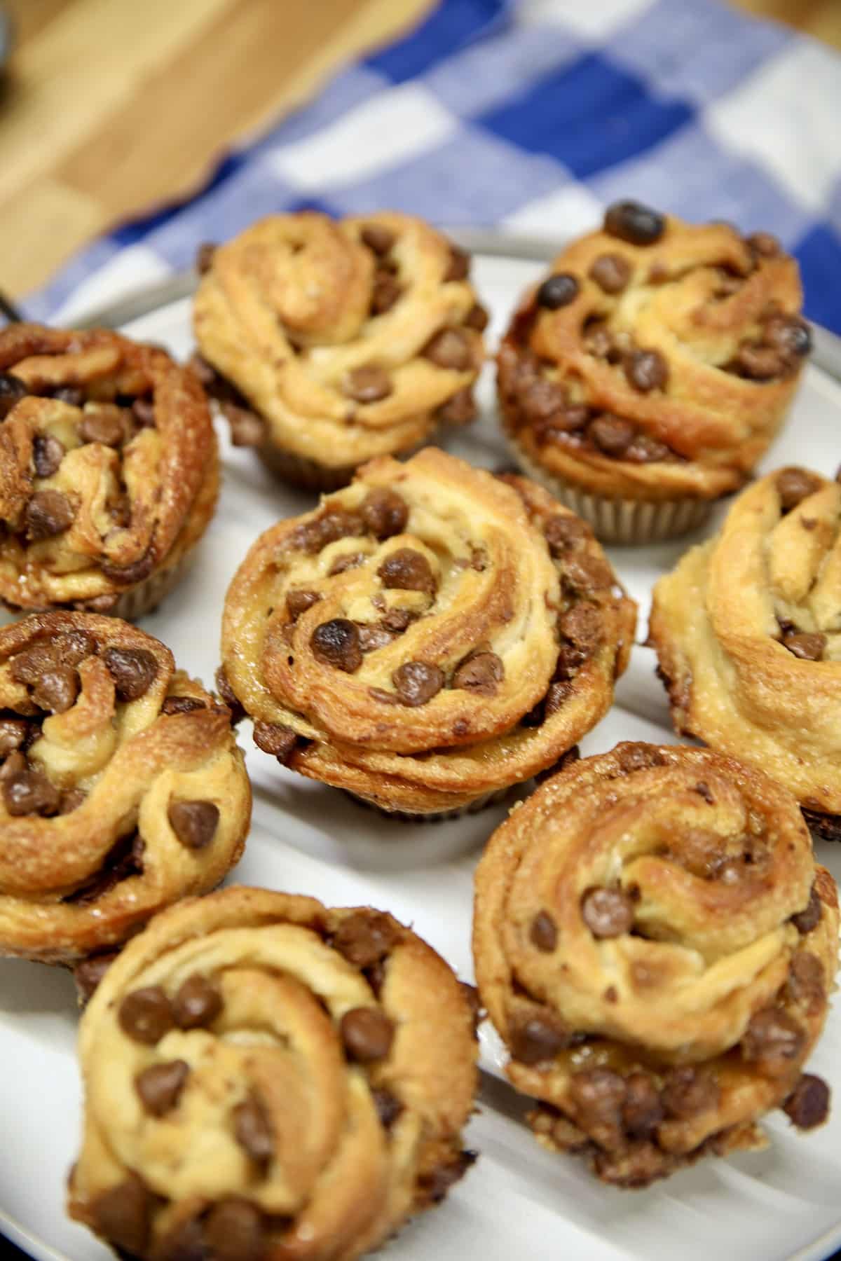 Chocolate chip croissant muffins on a plate.