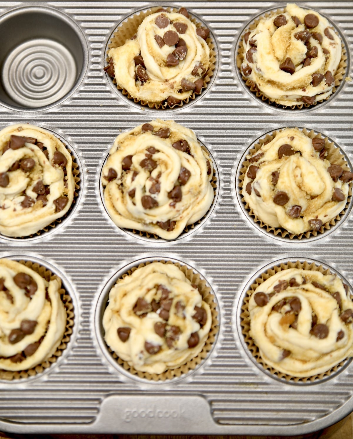 Muffin tin with chocolate chip croissant muffins.