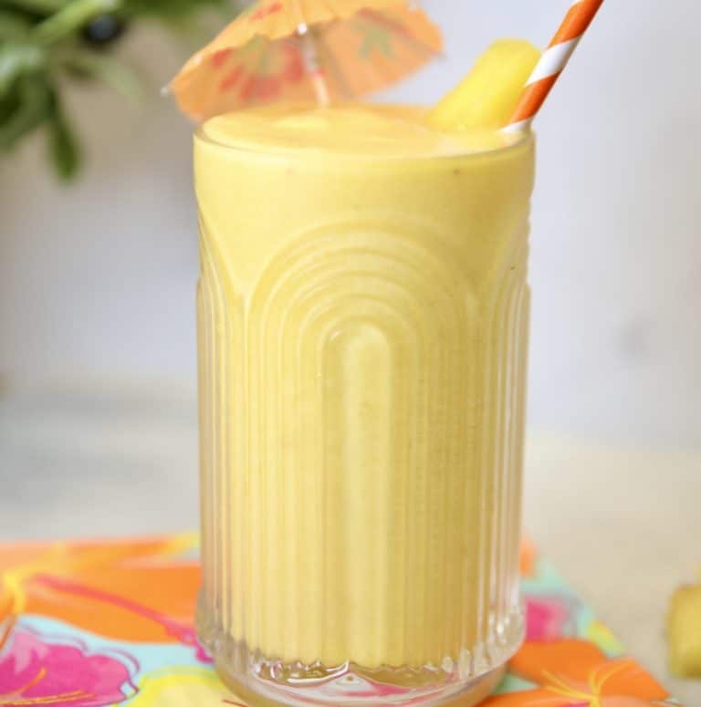 Glass with pineapple smoothie.