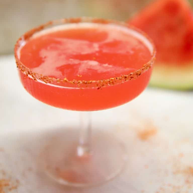 Watermelon margarita in a coupe glass.