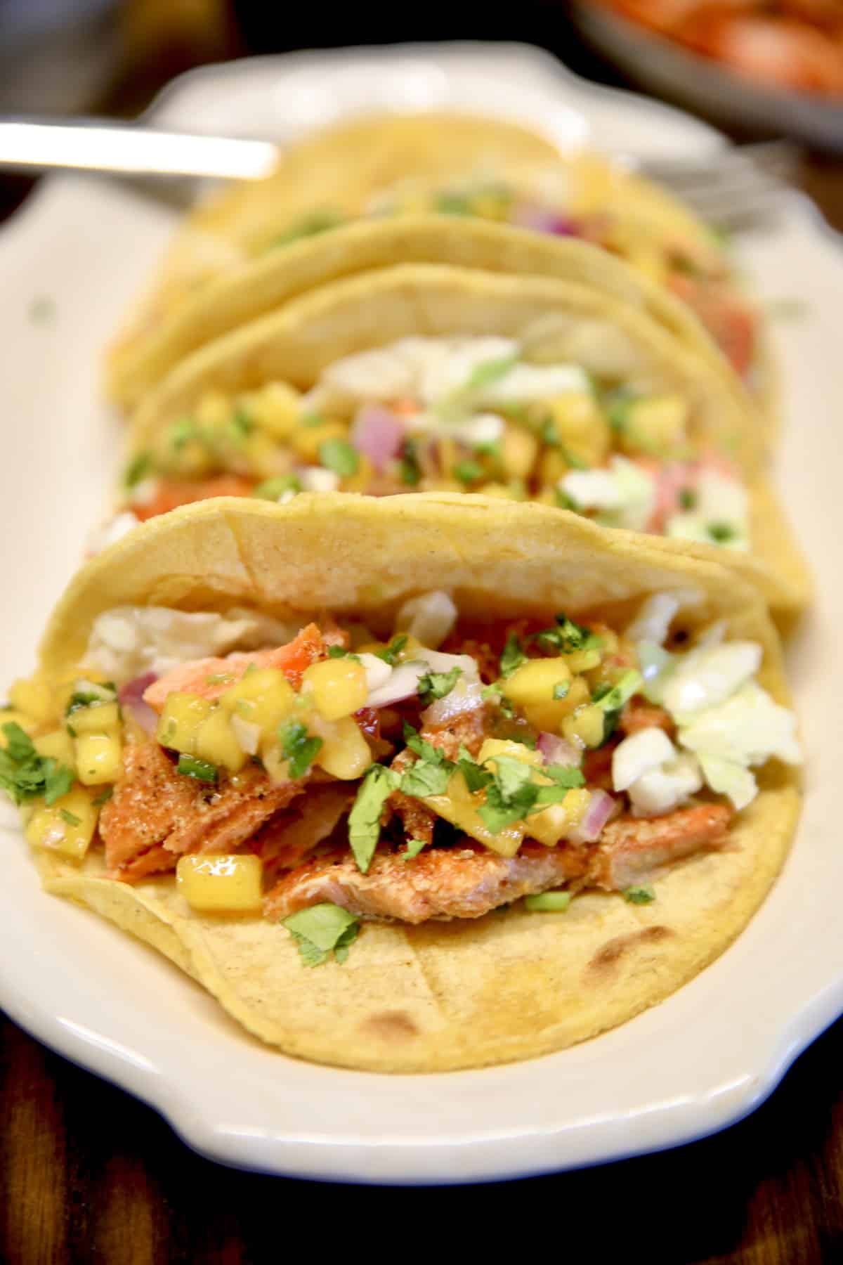 Salmon tacos on a platter.