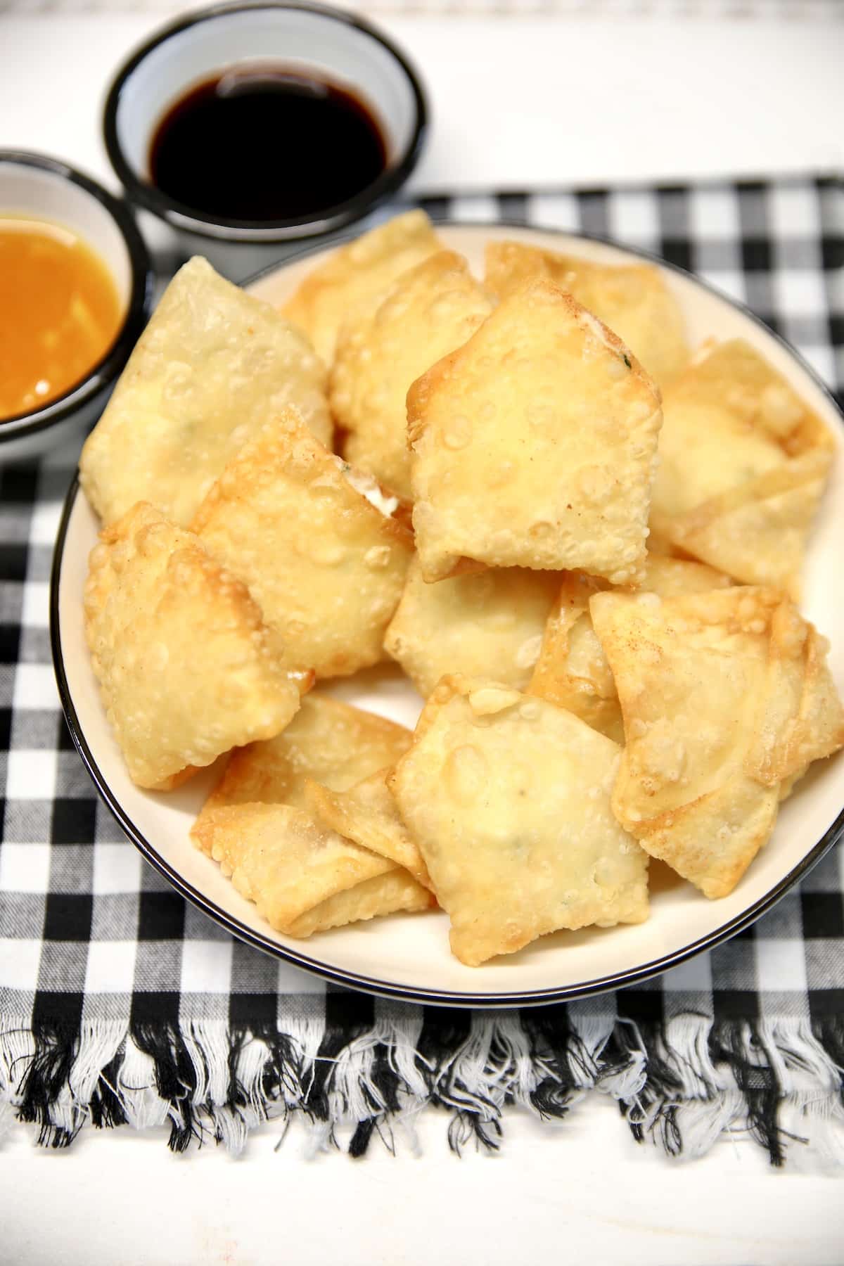 Shrimp Rangoon with cream cheese filling. Plate of shrimp rangoon.