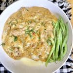 French onion chicken over mashed potatoes with green beans.