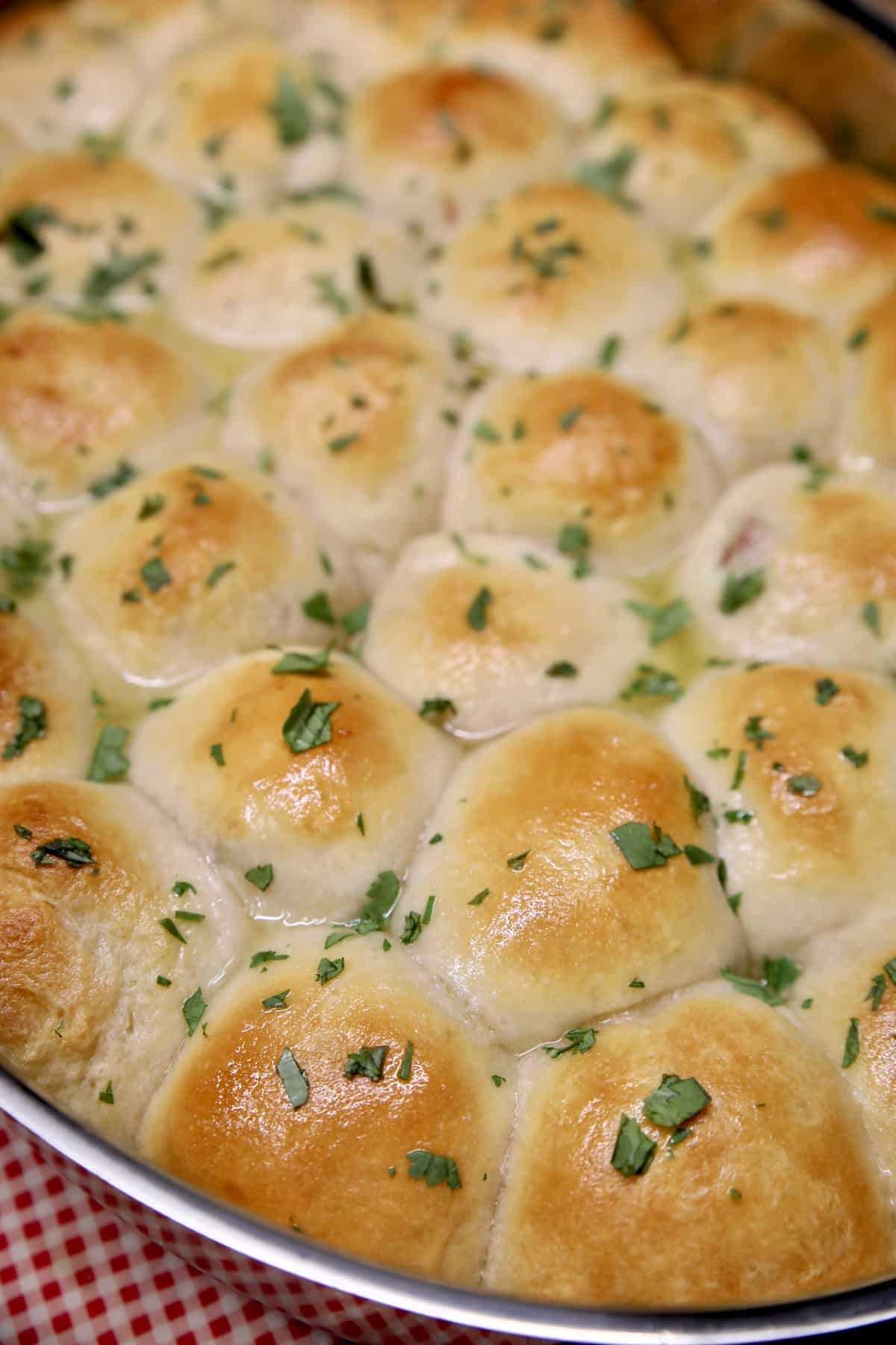 Ham and cheese stuffed biscuit bake. Ham and cheese stuffed biscuits in a pan.