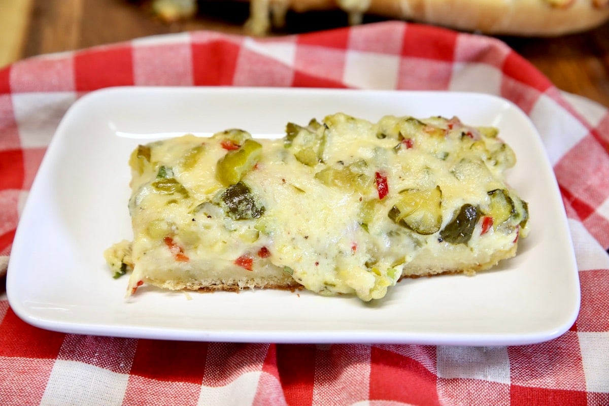 Cheesy Pickle bread on an appetizer plate.