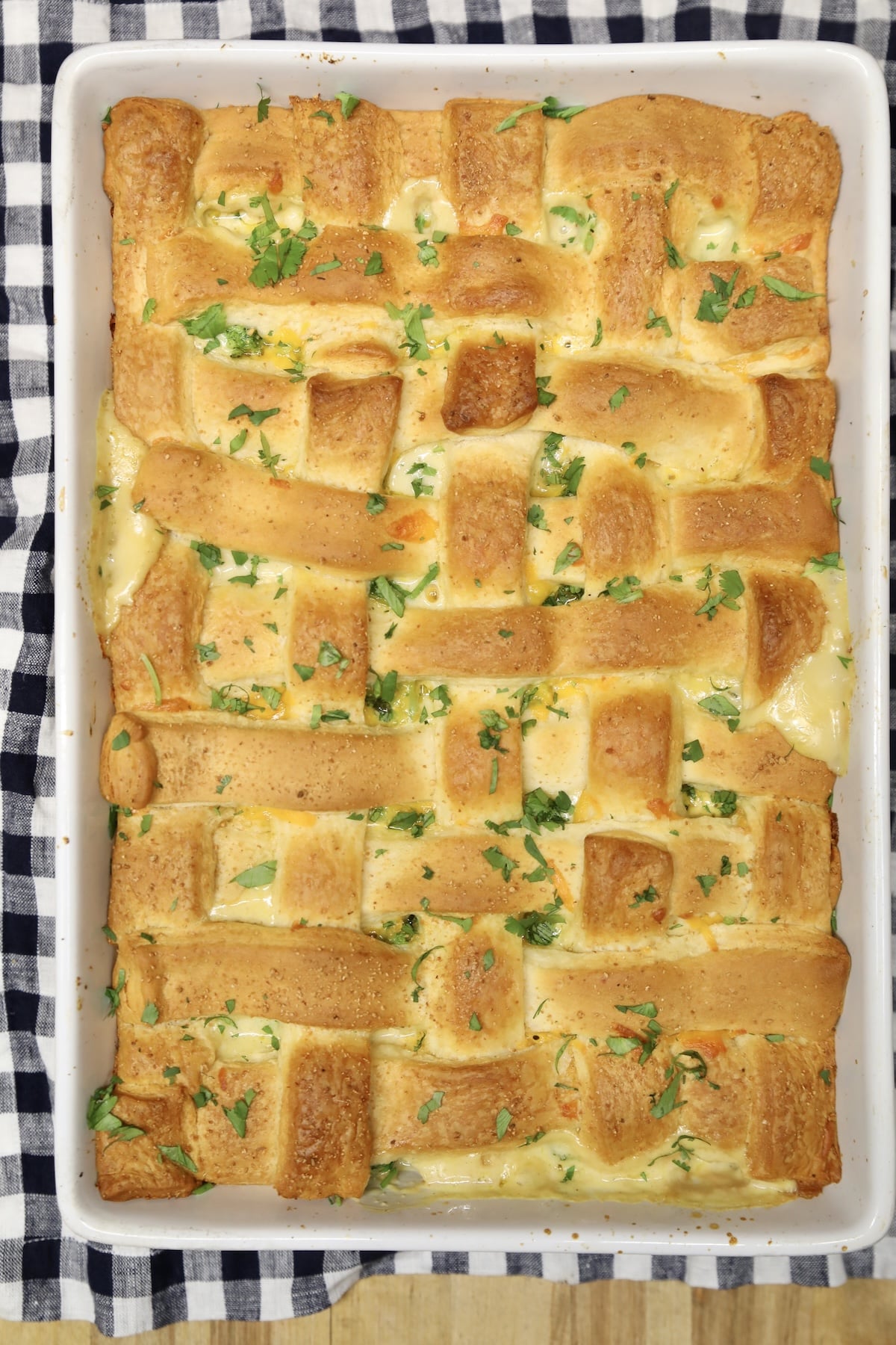 Casserole with chicken broccoli and crescent lattice crust.