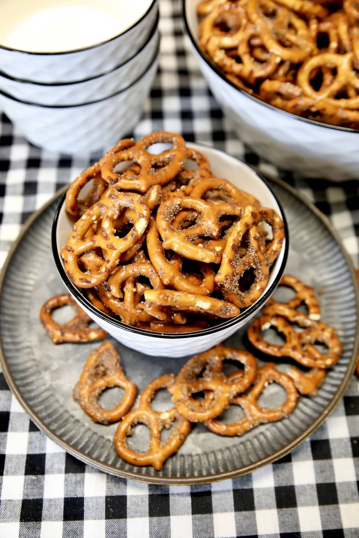 Cinnamon Sugar Pretzels in a bowl on a tray, pretzels on tray.