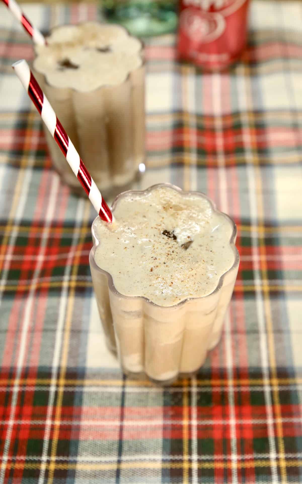 Dr Pepper Cocktail in 2 glasses on plaid cloth.