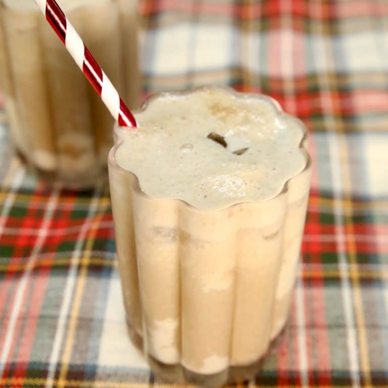 Eggnog Dr Pepper drink in a glass with straw,