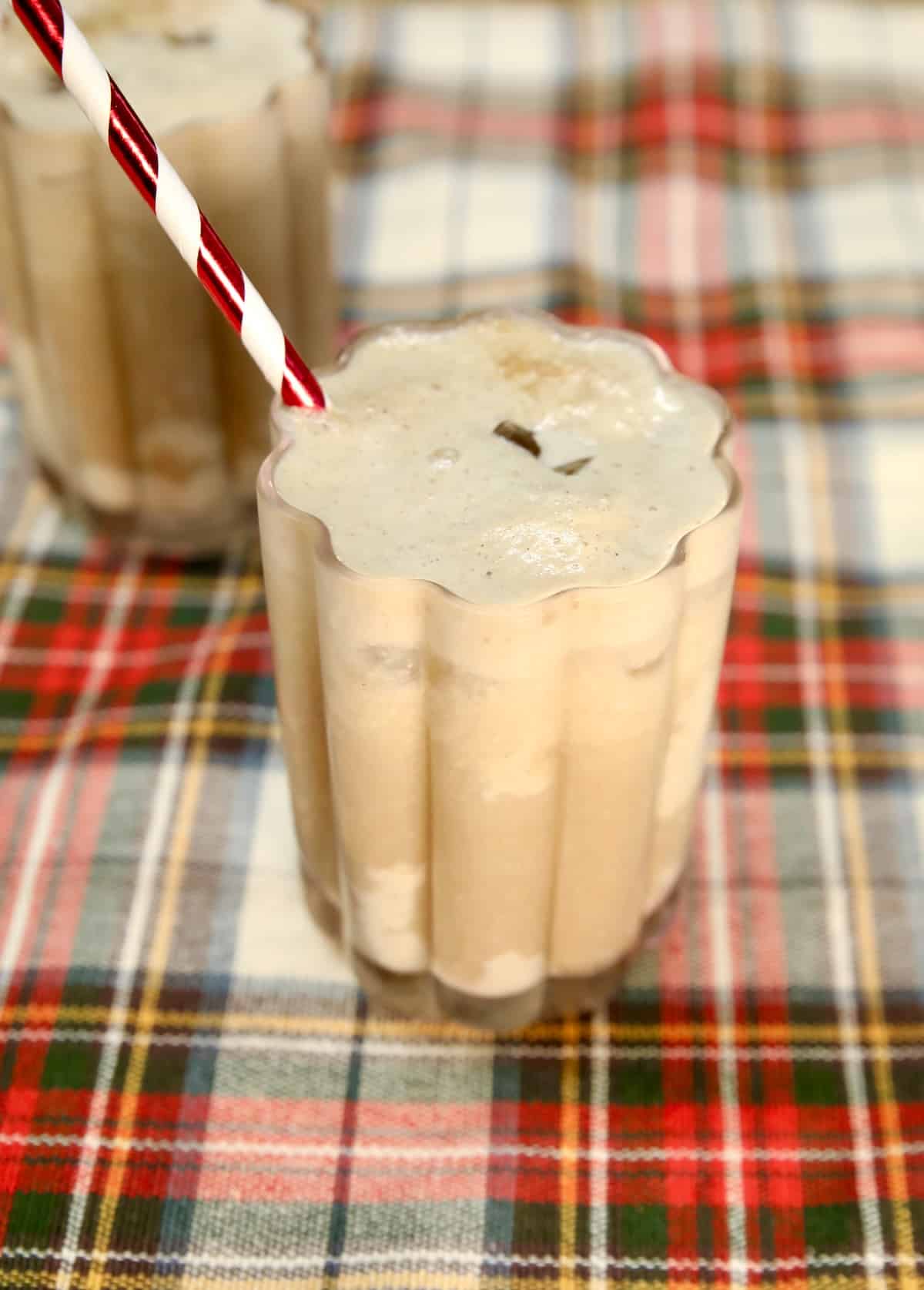 Glass filled with Dr Pepper, eggnog and rum.