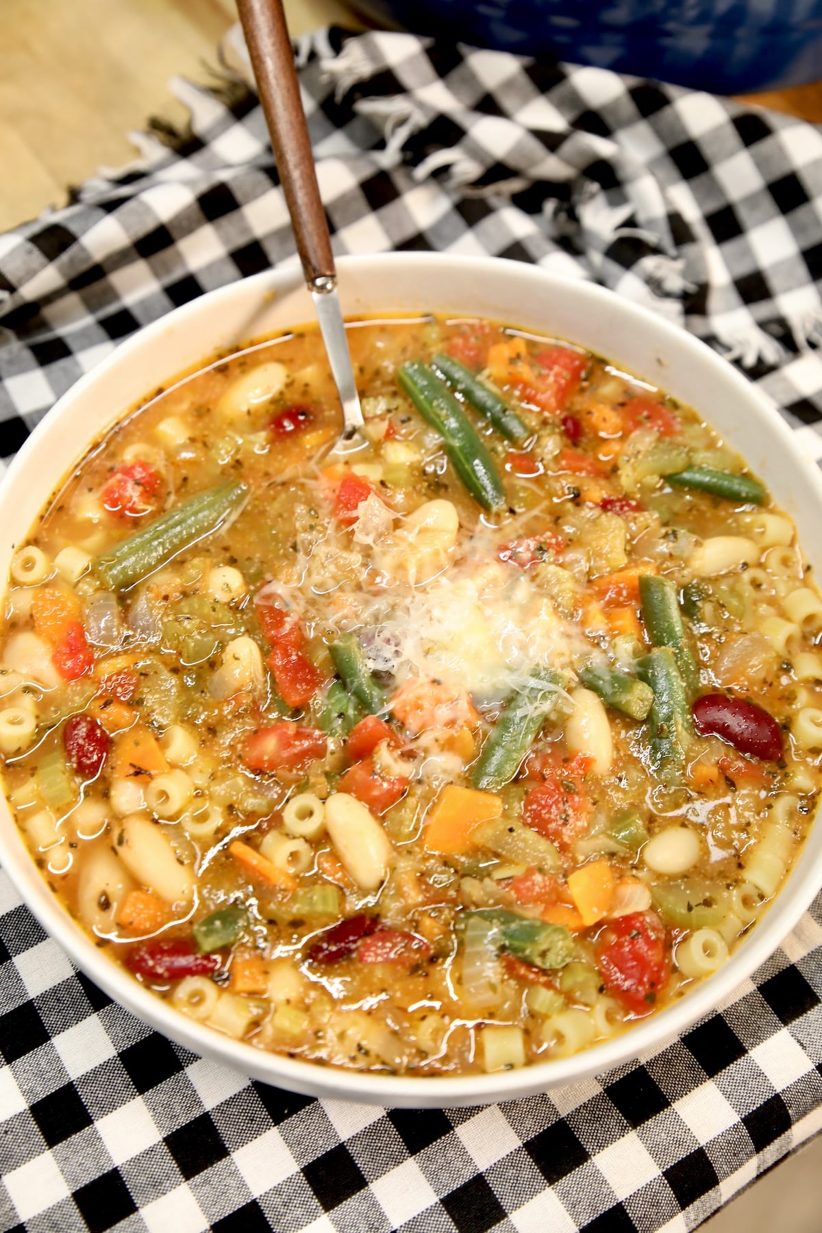 Bowl of Italian soup with spoon.