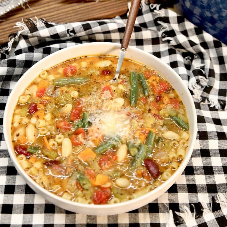 Bowl of minestrone soup with parmesan cheese.