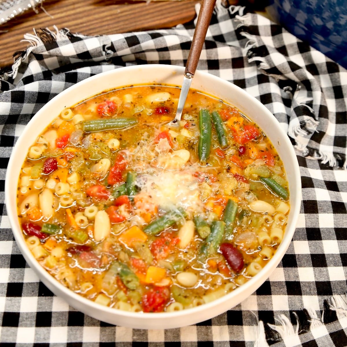 Bowl of minestrone soup with parmesan cheese.